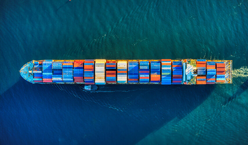 image of a large container ship, used as a blog post banner that is written about existing shipping delays under the title of covid-19 update as of june 2021